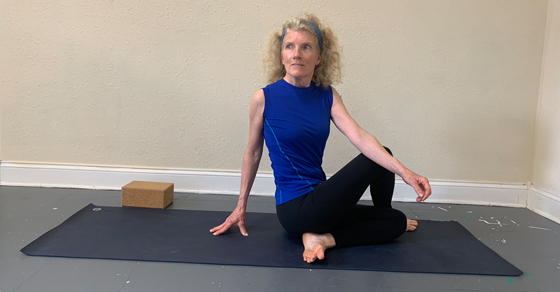Michelle Fielding in half spinal twist at YogaFirst studio